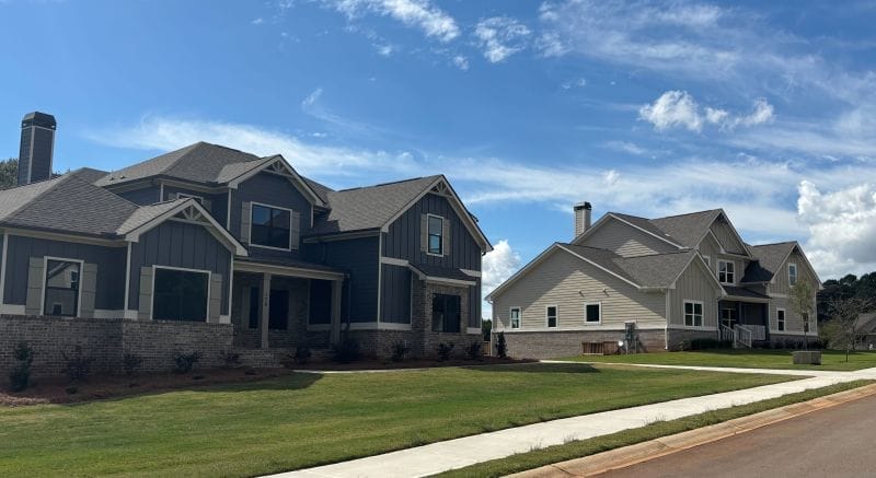 Finished homes at Steeple Chase lot delivery project, with completed properties ready for sale.